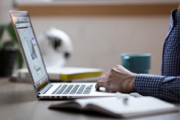 a person typing on a keyboard